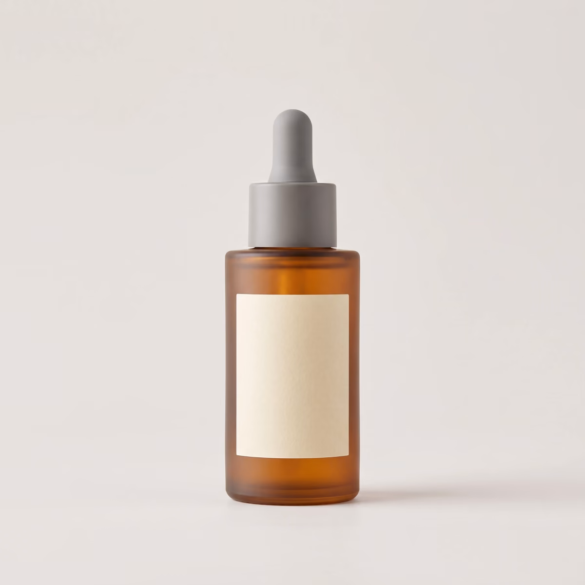 The serum bottle photographed straight on against a plain light grey background for a product listing.