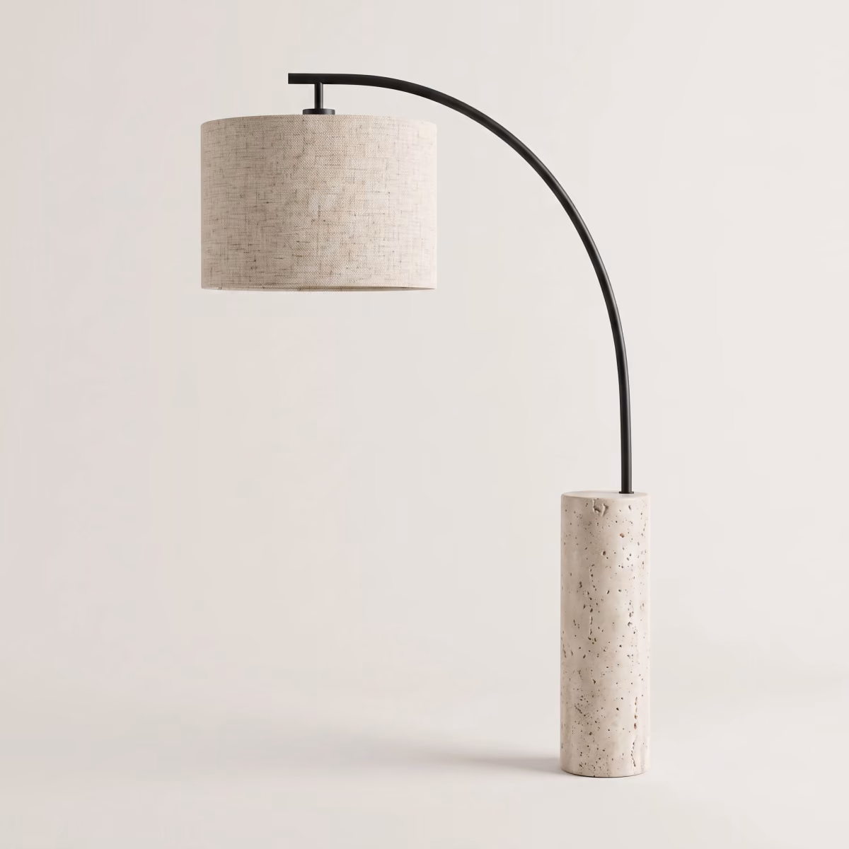 The arc table lamp photographed from the side against a plain light grey background for a catalog listing.