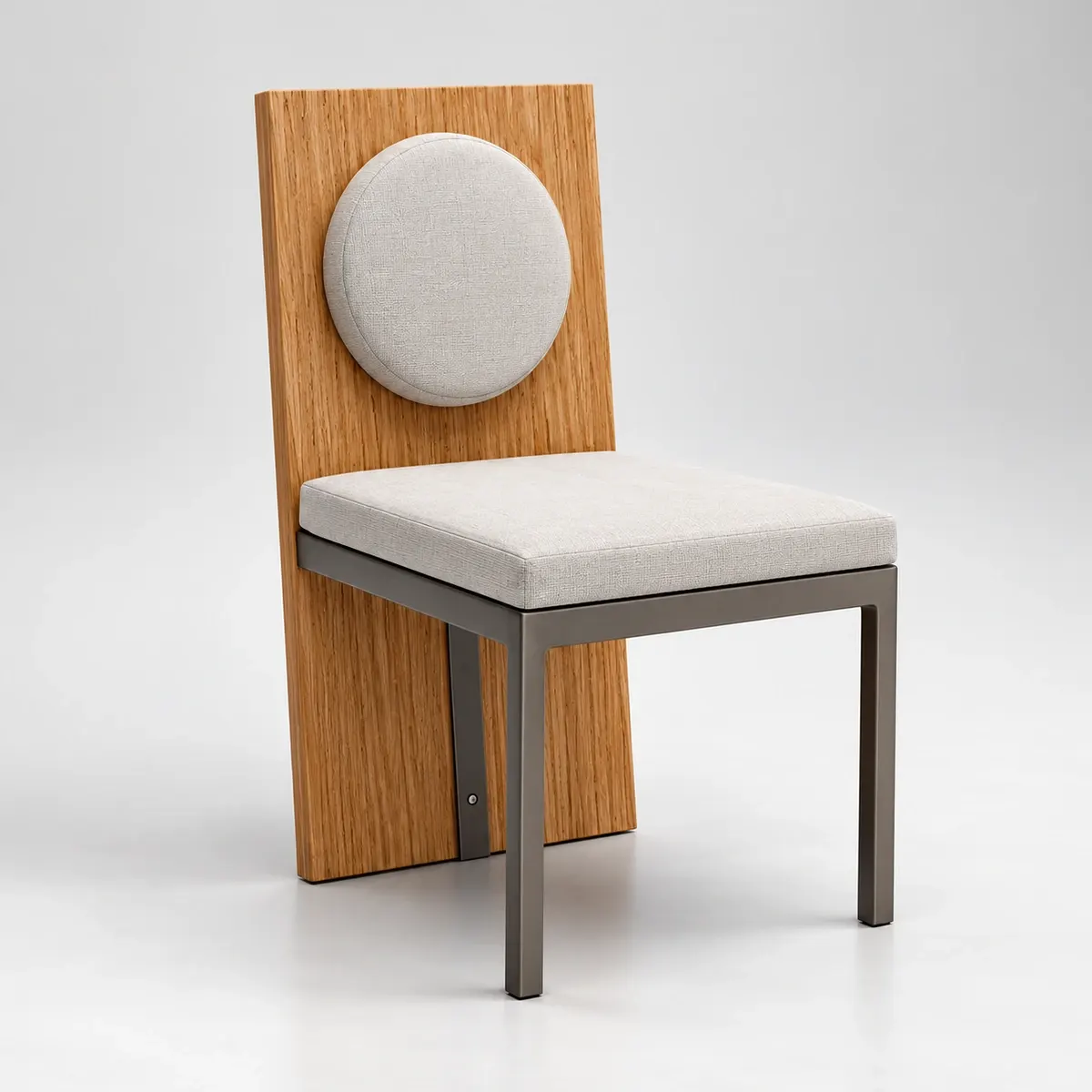 Three-quarter studio view of the oak and ivory dining chair with a graphite metal frame on a clean neutral background.
