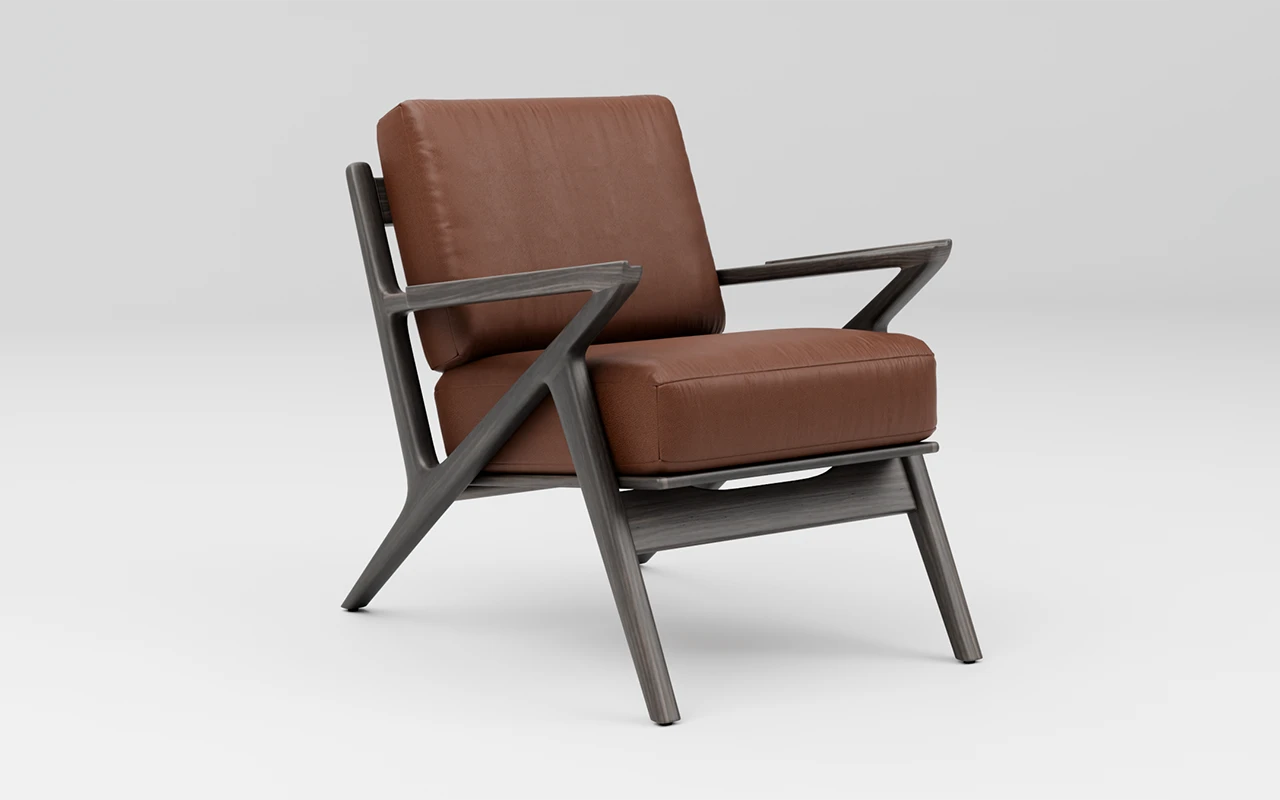 Lounge chair with brown leather cushions and a black wood frame.